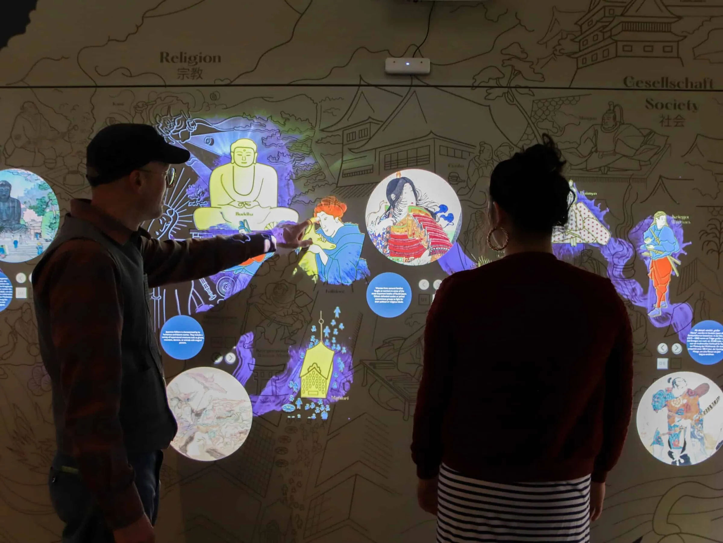 Interactive wall with projection mapping and touch screens